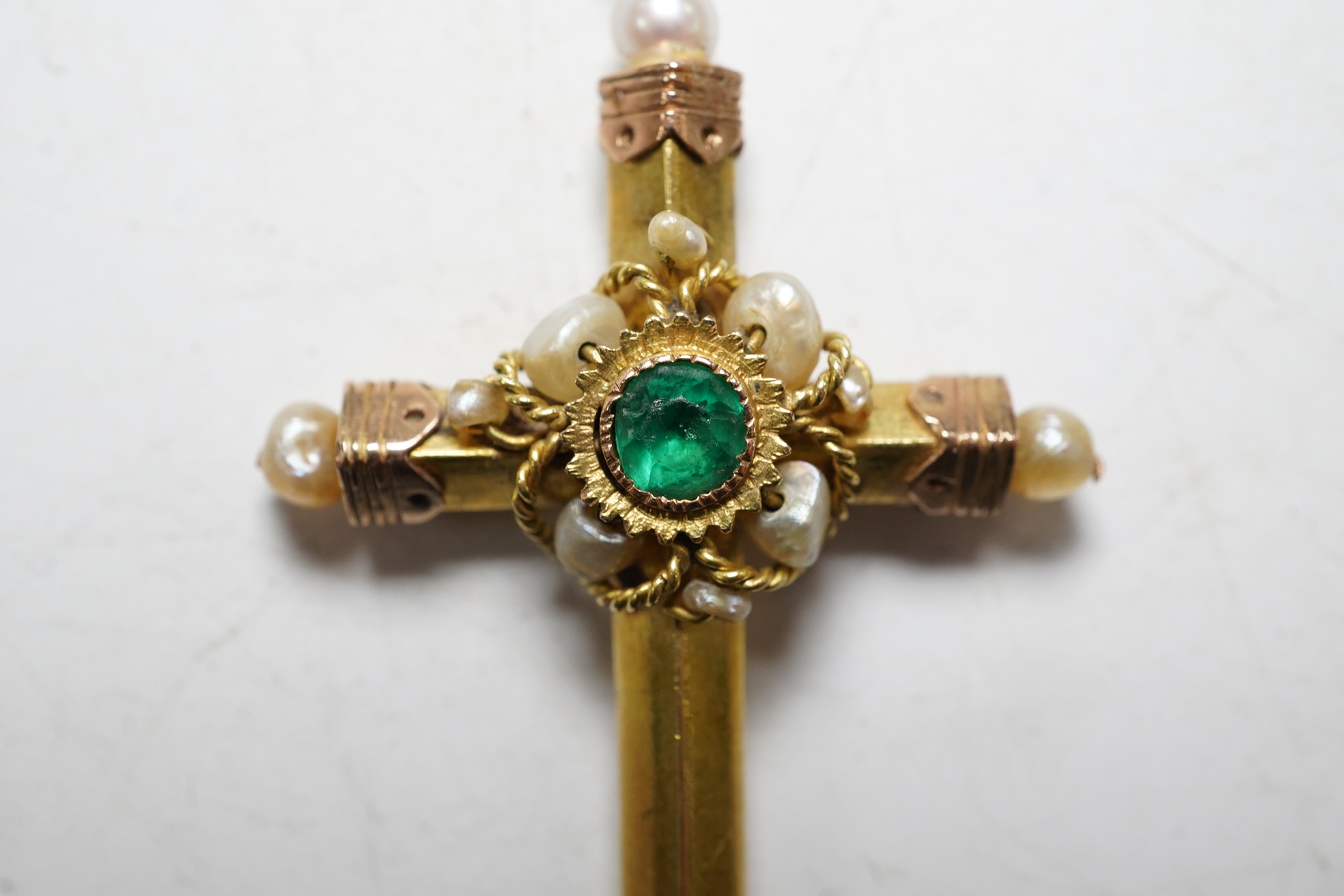 A 19th century Continental gold cross pendant set with an emerald and pearls, 4.5cm, gross 3.6 grams. Condition - good